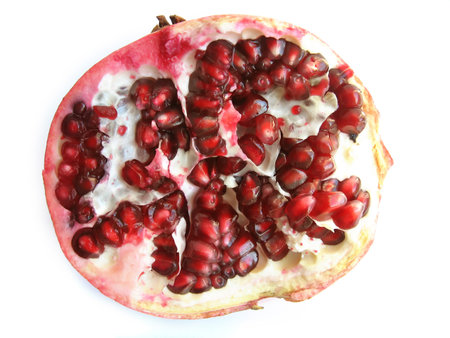 half pomegranate, isolated on a white backgroundの写真素材
