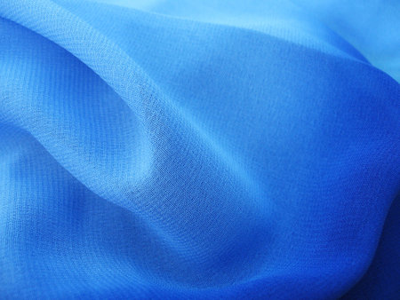 folds of blue chiffon fabric, texture, backgroundの写真素材