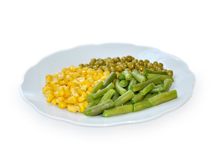 asparagus, green peas and corn, isolated on a white backgroundの写真素材