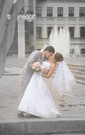 Bride and groom dancing in a street - outdoorの写真素材