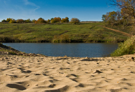 sandy shore of the lake, autumn landsÑapeの写真素材