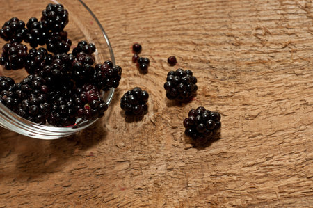 blackberry on old wooden table backgroundの写真素材