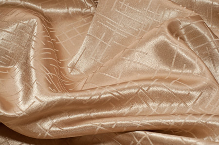 folds of golden silk fabric, texture, backgroundの写真素材