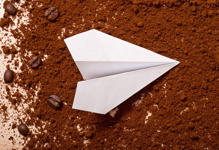 the coffee and paper airplane, top view. Travel conceptの写真素材