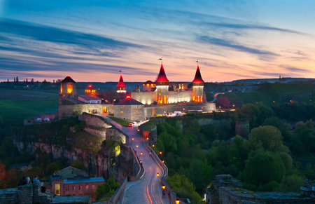 Night light of old castle in Kamenetz-Podolsk in Ukraineのeditorial素材