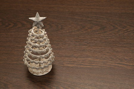 Christmas tree on a dark wooden backgroundの写真素材