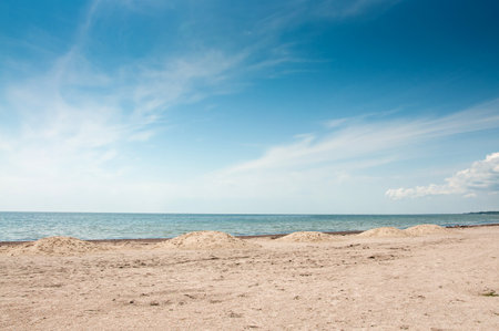 The beautiful empty sandy beach on blue sky background. Black Sea, Ukraine, Skadovskの写真素材