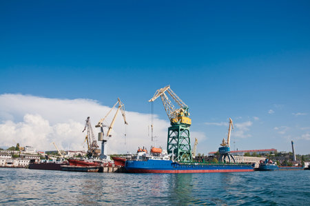 SEVASTOPOL, CRIMEA, UKRAINE - MAY 06, 2013: Ships and cranes in the cargo port in the Sevastopol Bayのeditorial素材