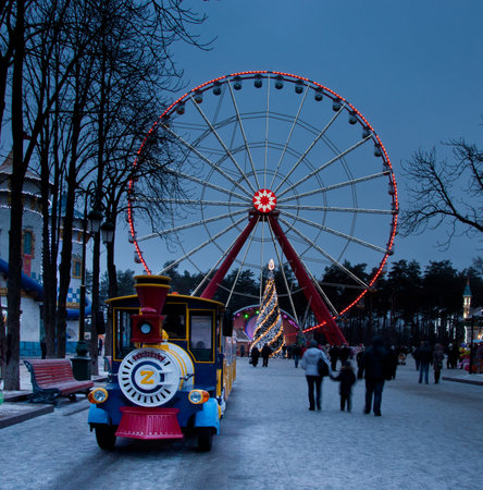 GORKY CENTRAL PARK, KHARKOV, UKRAINE - JANUARY 01, 2014: Gorky Central Park of Culture and Leisure in Kharkov, Ukraine on January 01, 2014. The Ferris wheel is highest in Ukraine. The Ferris wheel and Christmas tree in winter Central Park in Kharkovのeditorial素材