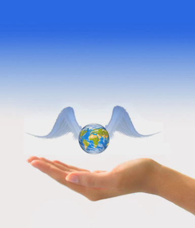 Earth with wings in handの写真素材
