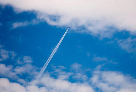 The trail from the plane in the sky