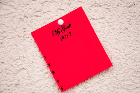 Red notepad on the wall With the words my goals for 2017