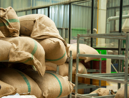 Bags in the warehouse on the racks. Coffee, arabica, rice.