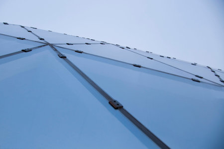 Underside panoramic and perspective view to steel blue glass hight building