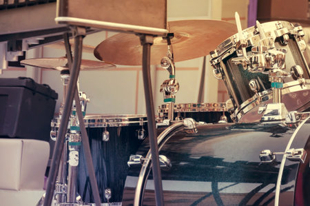 A drum set, a musical instrument, stands on the stage in the street. toningの写真素材