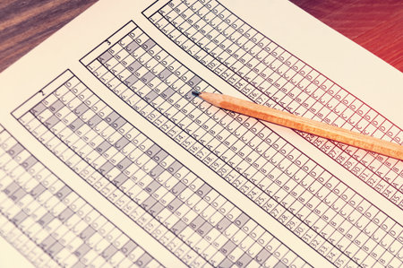 Form for the exam with the pencil lying on it. Testing. Selective focusの写真素材