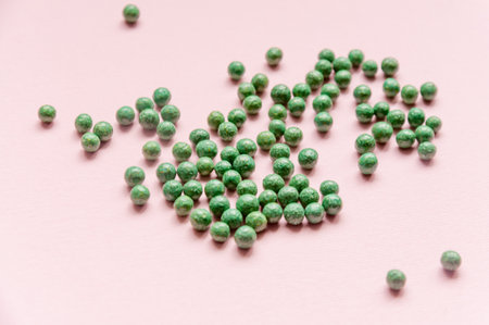 Natural vegetable biologically active additive. In the form of small green balls. Natural medicines from Asiaの写真素材