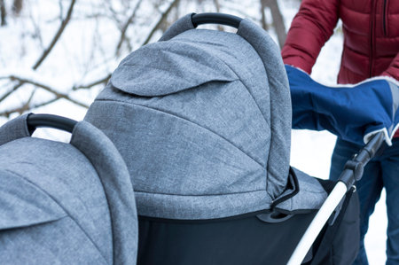 Stroller for twins close-up. Stroller with clutch for hands