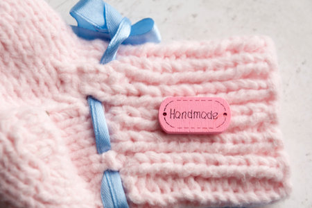 DIY Knitted pink warm wool socks for a newborn girl. Selective focusの写真素材