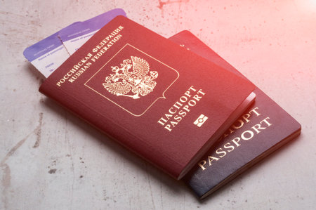 Two travelers passports Russian and Belarus with boarding passes for the plane. Travel concept Selective focusの写真素材