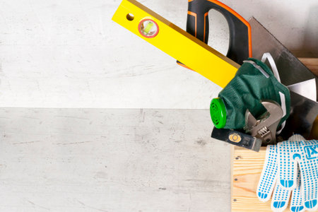 Wooden box with construction tools on a light concrete background. Selective focusの写真素材