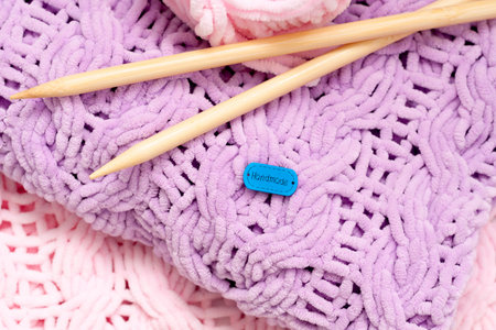 A few bright colored knitting needles bedspreads or blankets. Comfort, homely warmth. Selective...