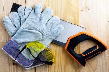 Work on the construction or repair of the house. Renovation. Use saw work gloves tape measure. Concept  DIY workplace safety.の写真素材