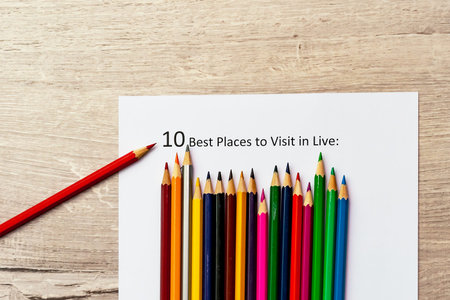 The inscription 10 best plases to visit in live. Colour pencils. Concept of bright life