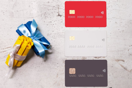 Three bank cards on a light background. Near paper scrolls. Creativity, wish listの写真素材