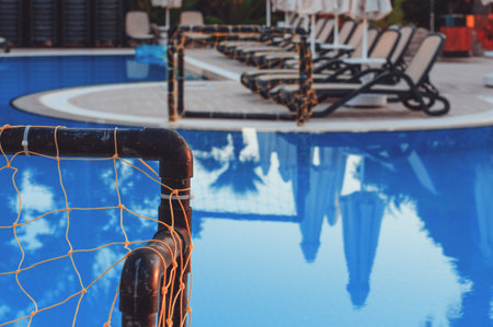 Water polo gate near a full pool. Water sports. Active leisure
