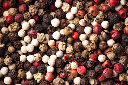 Multi-colored pepper seeds close-up. Occupy the frame completely. Selective focus. Seasoning and...
