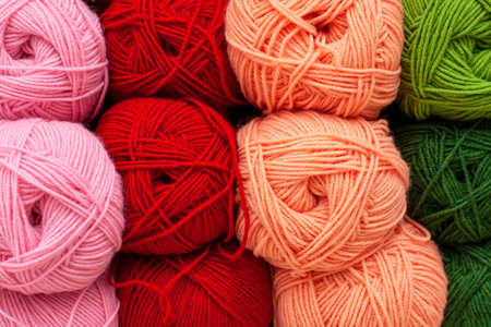 Shelf in a store with multi-colored skeins of yarn. Woolen, acrylic, silk thread. Knitting and crocheting. Preparing for the fall - knitting warm clothes. Needlework, hand made.の写真素材