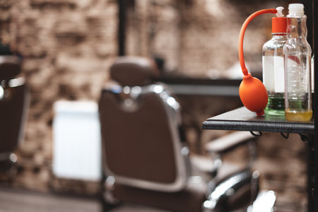 Barber tool in barbershop. Hairdresser tool. Scissors, combs, razors, clippers. Tool for the wizard. Organization of the workplace. Selective focusの写真素材