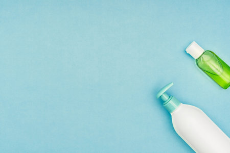 Coronavirus, covid-19. Antiseptic gel, liquid we, protective mask on a blue background. Self-isolation and quarantine, personal protective equipmentの写真素材