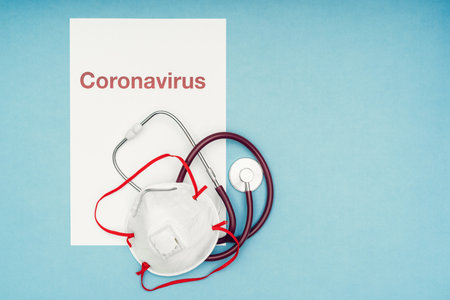 Coronavirus, covid-19. The inscription coronavirus on a blue background. Self-isolation and quarantine, personal protective equipment, phonendoscope and stethoscopeの写真素材