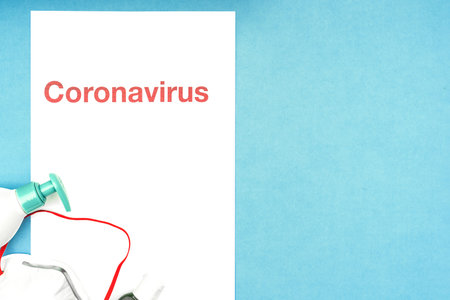 Coronavirus, covid-19. The inscription coronavirus on a blue background. Self-isolation and quarantine, personal protective equipment, phonendoscope and stethoscopeの写真素材