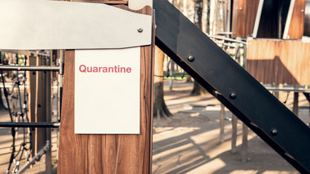 Quarantine advertisement on an empty playground in the park. Self-isolation and quarantine in a pandemicの写真素材