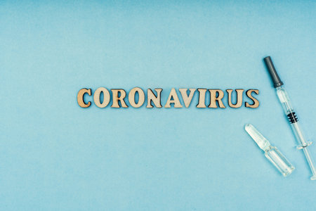 Coronavirus, covid-19. The inscription coronavirus on a blue background. Self-isolation and quarantine, personal protective equipment, phonendoscope and stethoscopeの写真素材
