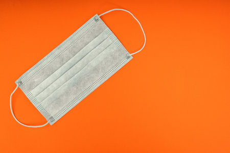 Protective medical mask. Personal protective equipment. Coronavirus pandemic.の写真素材