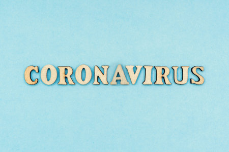 Coronavirus, covid-19. The inscription coronavirus on a blue background. Self-isolation and quarantine, personal protective equipment, phonendoscope and stethoscope.の写真素材