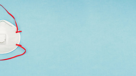 Coronavirus, covid-19. Antiseptic gel, liquid we, protective mask on a blue background. Self-isolation and quarantine, personal protective equipment.の写真素材