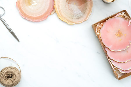 Creativity and craft. Resin coasters and packaging for them. Gift wrapping. Decorative packaging. Idea for business. Remote work, work at home. Art coasters.の写真素材