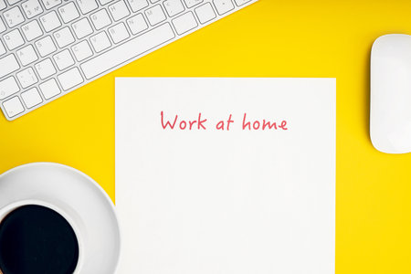 White keyboard and mouse. The inscription stay home on a white sheet of paper. Remote work, self-isolation, work at home, quarantine. Inscription work at home.の写真素材