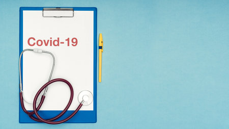 Coronavirus, covid-19. The inscription covid-19 on a blue background. Self-isolation and quarantine, personal protective equipment, ampoule and syringe.の写真素材