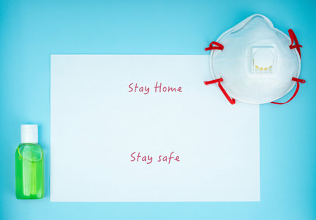 Coronavirus, covid-19. The inscription stay home, stay safe on a blue background. Self-isolation and quarantine, personal protective equipmentの写真素材