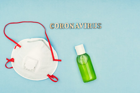 Coronavirus, covid-19. The inscription coronavirus on a blue background. Self-isolation and quarantine, personal protective equipment, phonendoscope and stethoscope.の写真素材