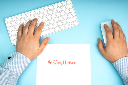 White keyboard and mouse. Remote work, self-isolation, work at home, quarantine. The inscription stay home.の写真素材