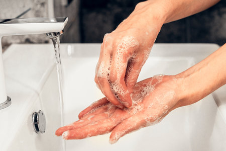 Coronavirus. Proper washing and handling of hands. Liquid antibacterial soap. Self-isolation and hygiene.の写真素材