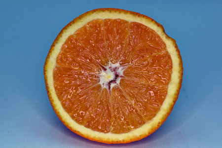 Juicy and sweet orange orange on a blue background