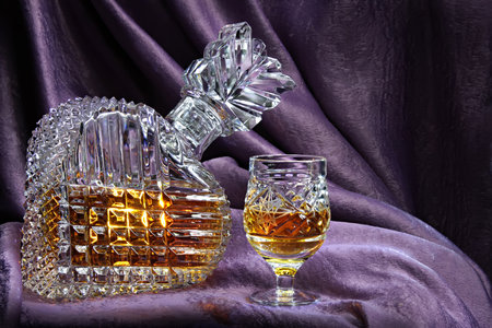 Still life with a crystal decanter and glassの写真素材